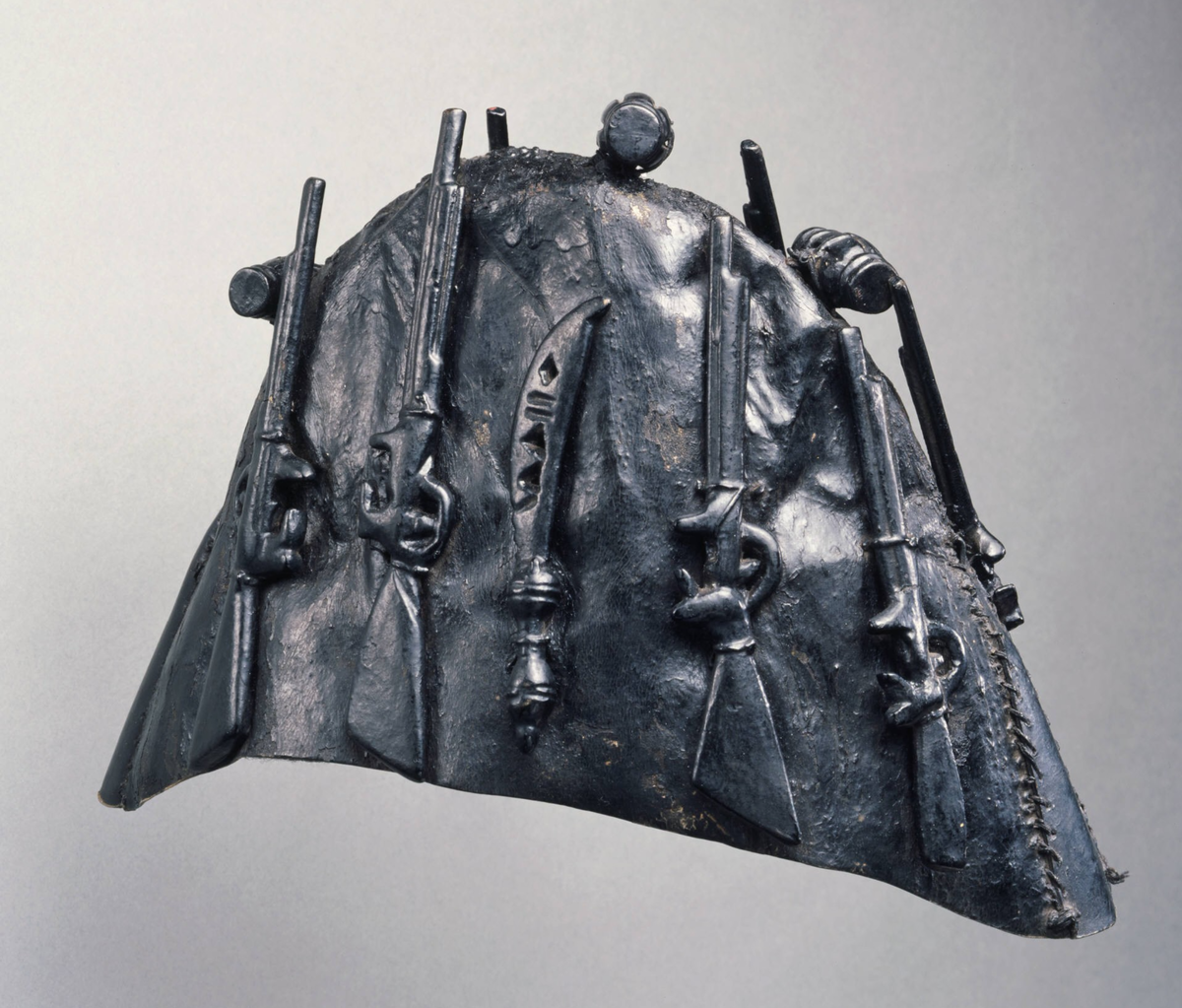 Akan artist, Ghana, Gun bearer or bodyguard’s cap (krɔbɔnkyɛ), 19th century. Duiker rawhide, wood, paint, and leather. Bequest of John B. Elliott, Class of 1951