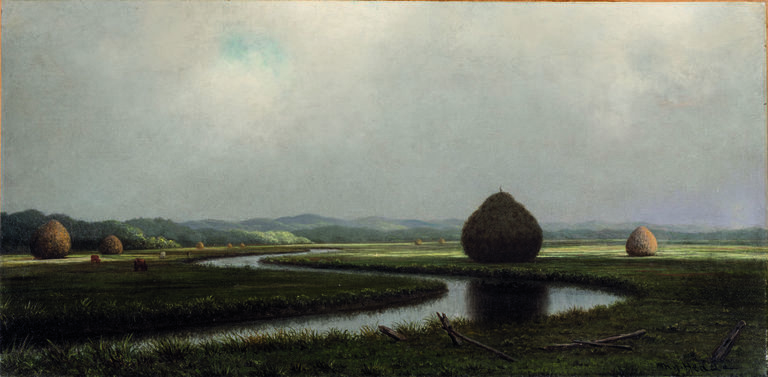 A placid river meanders through lush green marsh dotted with haystacks, illuminated by breaks of light in a vast cloudy sky